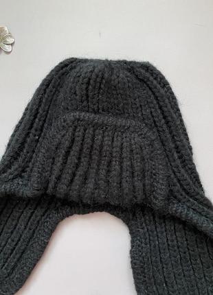 Теплая зимняя шапка черного цвета4 фото