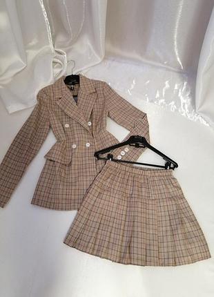 Костюм клітка спідниця пліснява та піджак