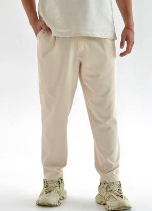 Чоловічі стильні штани вільного крою під ремінь бежеві1 фото