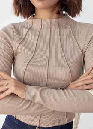 Гольф в рубчик із цільнокроєним коміром