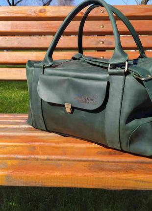 Дорожная кожаная сумка зеленого цвета1 фото
