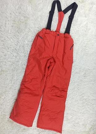 Яркие рыжые лыжные термо штаны.