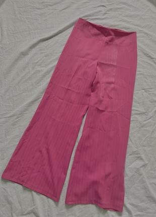 Рожеві брюки