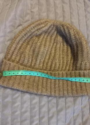 Теплая шапка от бренда koru из меха оппосума, мериноса м шелка