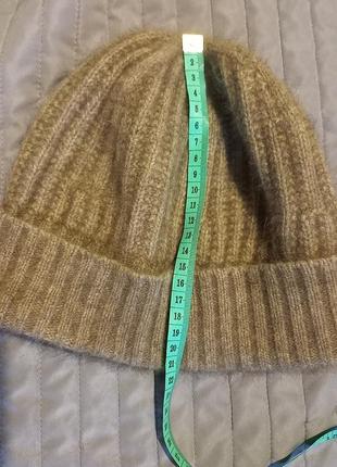 Теплая шапка от бренда koru из меха оппосума, мериноса м шелка
