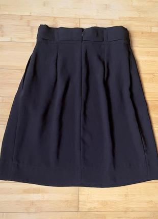 Черная юбка с боковыми карманами2 фото