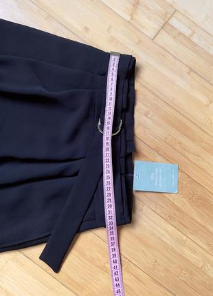 Черная юбка с боковыми карманами4 фото