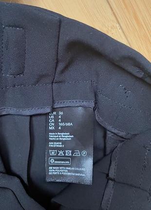 Черная юбка с боковыми карманами6 фото
