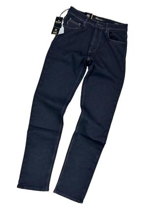 Чоловічі зимові джинси на флісі1 фото