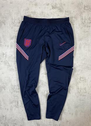 Nike england: элегантные темно-синие брюки для стильных приключений1 фото