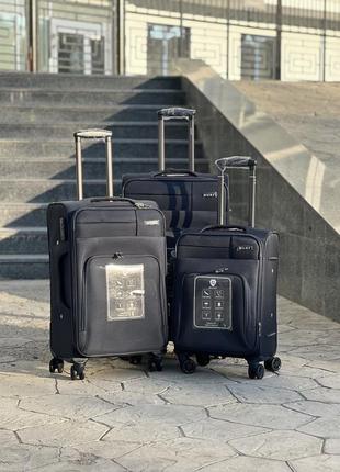 Якісна валіза з щільної тканини фірми nuri ,надійні колеса ,розширення ,чемодан ,кодовий замок,великий ,середній ,маленький,дорожня сумка1 фото