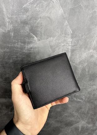 Чоловічий шкіряний гаманець на кнопці armani2 фото