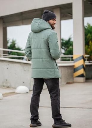 Подовжена зимова стьобана куртка на блискавці з капюшоном з кішенями4 фото