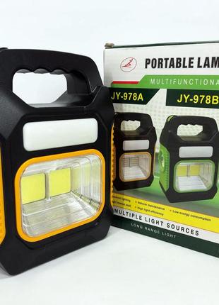 Портативний ліхтар лампа jy-978b акумуляторний із сонячною панеллю + power bank. колір жовтий1 фото