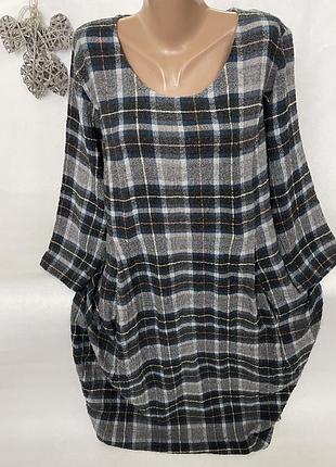 Стильное теплое платье в клетку с карманами