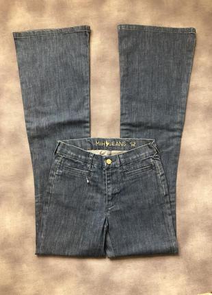 Стильные джинсы клеш от колена2 фото