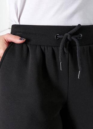 Утепленные спортивные штаны на флисе с резинкой в талии с кошенями с высокими манжетами из низа брюк9 фото