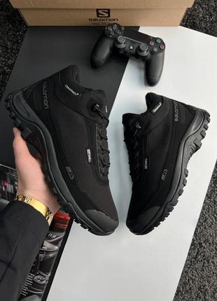 Salomon shelter black white fur