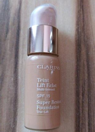 Антивозрастной тональный крем clarins teint lift eclat super restorative foundation spf 15  10 tende1 фото