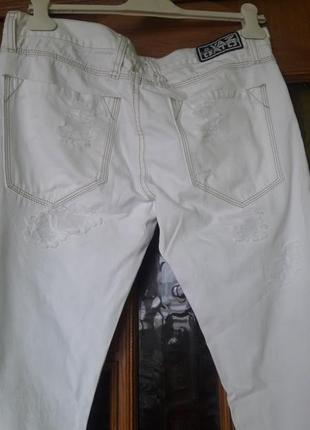 Білі жіночі брюки з потертими деталями.виробництво сша3 фото