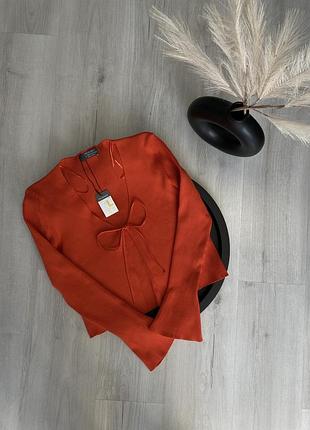 Помаранчева кофтина