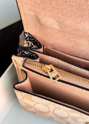 Маленькая популярная светлая кожаная сумочка кросс боди от coach5 фото