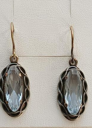 Позолоченные серебренеые серьги с топазами .