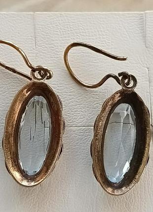 Позолоченные серебренеые серьги с топазами .