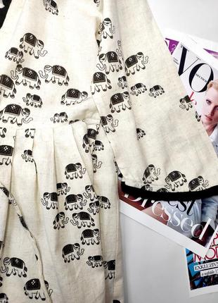 Блуза жіноча бежевого кольору вільного крою на завязках від бренду uharma m3 фото