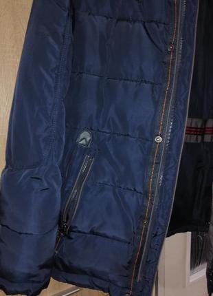 Продам зимнюю куртку мужскую в хорошем состоянии. размер 48.требуется заменить замок. возможен торг. темно - синего цвета3 фото