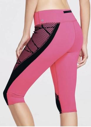 Яскраві спортивні шорти капрі fabletics