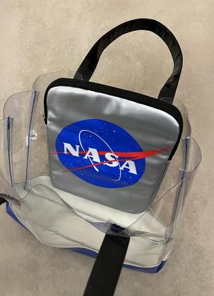 Эксклюзивная прозрачная сумка nasa, купленная в сувенирном магазине при космическом центре кеннеди (nasa) на мысе канаверал.3 фото