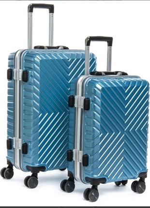 Abs пластикова дорожня валіза на 4-х колесах (комплект).1 фото