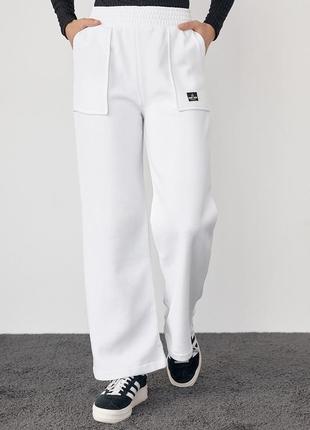 Трикотажні штани на флісі з накладними кишенями — молочний колір, l (є розміри)