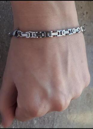 Мужской браслет из стали на руку.4 фото