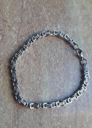 Мужской браслет из стали на руку.3 фото