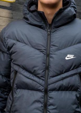 Пуховик nike у темно-синьому10 фото