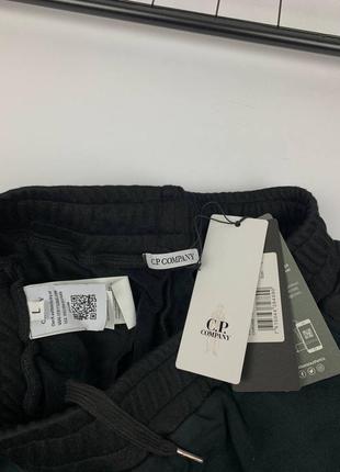 Мужские штаны черные c.p. company с нейлоновыми вставками4 фото
