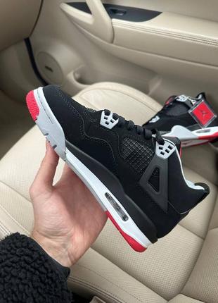 Стильні жіночі зимові кросівки  nike air jordan 4 retro black red fur чорні на хутрі5 фото