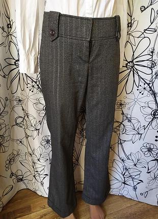 Классические брюки клеш в полоску серебристую