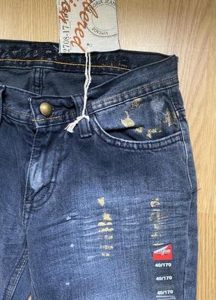 Нові джинси з потертостями та фарбою10 фото