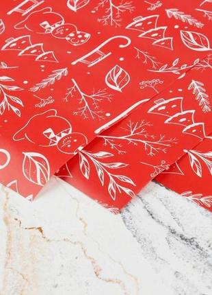 Бумага упаковочная новогодняя "новогодний микс на красном" 100см*70см (упаковка 15 листов)3 фото