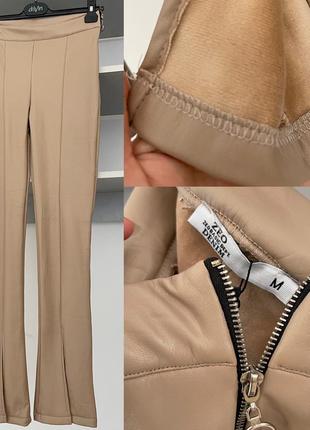 Брюки клеш от колена с разрезами, эко кожа