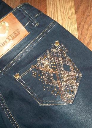 Шикарные джинсы с камнями yuke10 фото