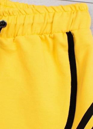 Стильні жовті короткі шорти2 фото