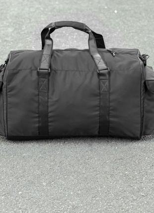 Вместительная мужская дорожная сумка сross на 55 литров черная тканевая со вставка из эко кожи9 фото