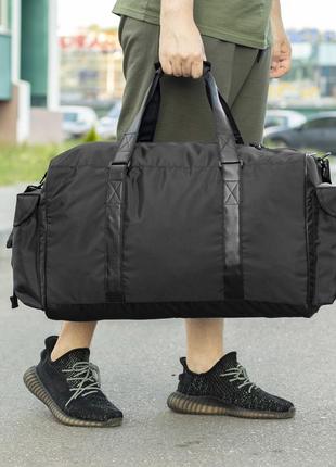 Вместительная мужская дорожная сумка сross на 55 литров черная тканевая со вставка из эко кожи7 фото