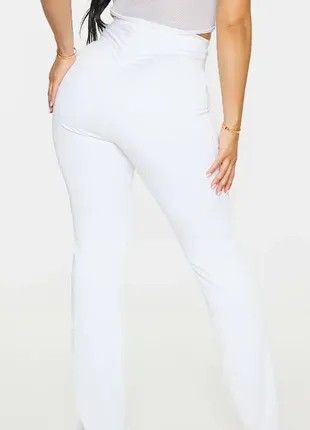 Білі жіночі розкльошені облягаючі штани, l2 фото