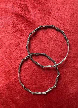 Серебряные серьги кольца с красивым переплетением1 фото