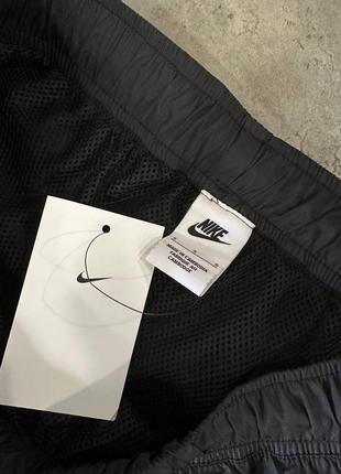 Брюки nike sportswear pant cf woven core track черные 927998-0106 фото